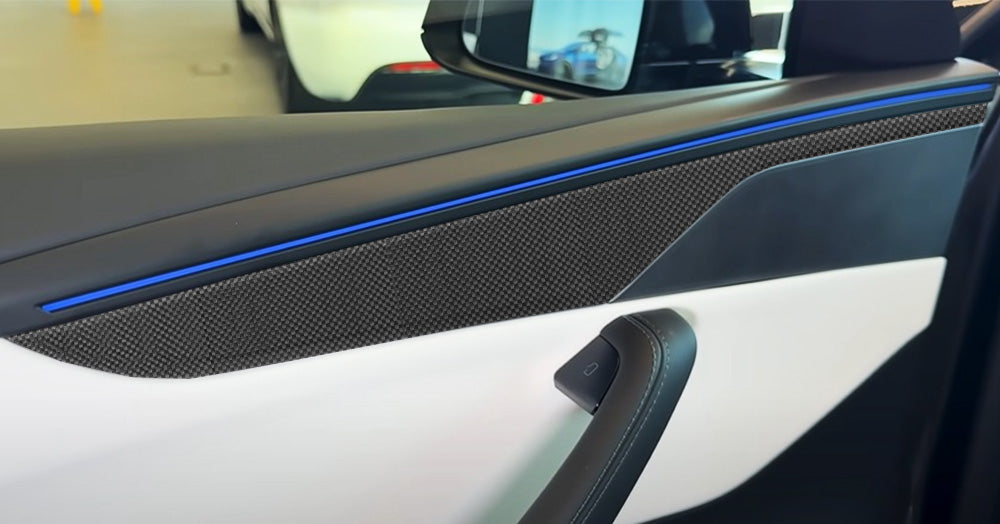 close up view of Tesla Model Y Juniper Carbon Fiber Door Panel Trim Covers